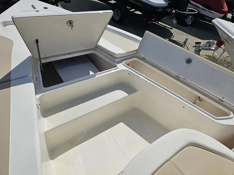 Slide: The Image of 2025 Bulls Bay 2200 XS boat storage compartments open, showcasing spacious interior design. - 19