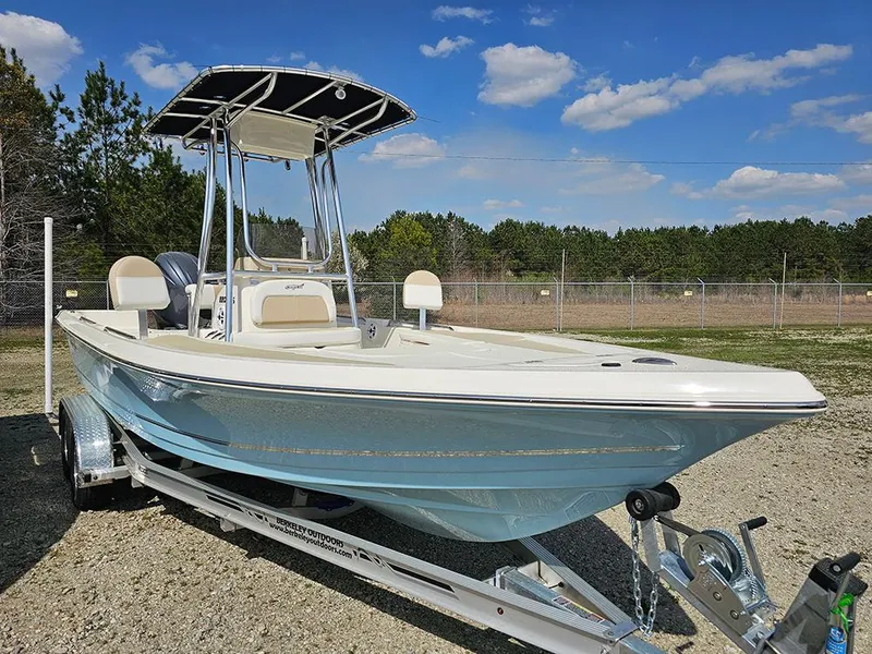 Slide: The Image of 2025 Bulls Bay 2200 XS boat on trailer, parked outdoors under blue sky. - 5