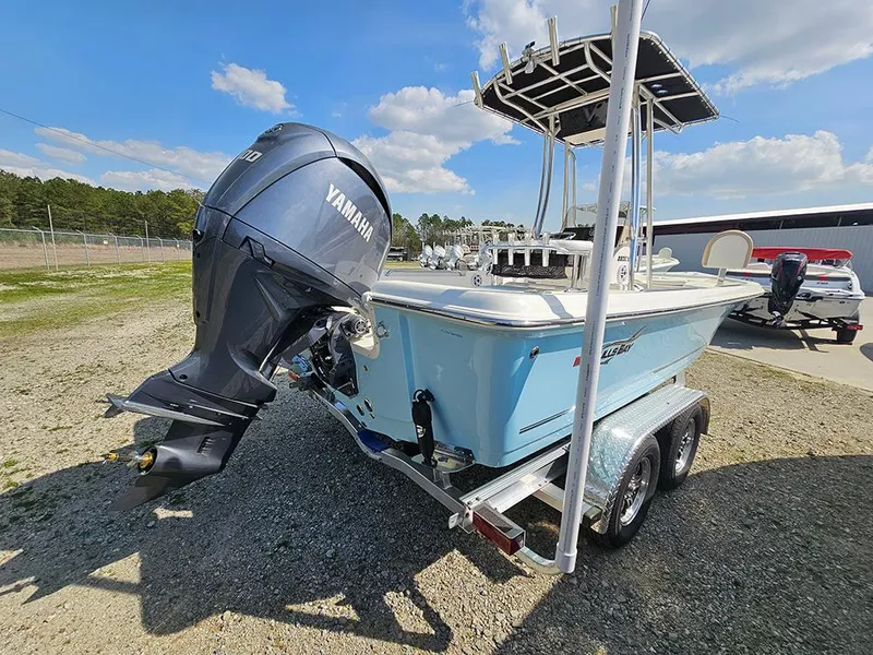 Slide: The Image of 2025 Bulls Bay 2200 XS boat with Yamaha engine on trailer, parked outdoors. - 7