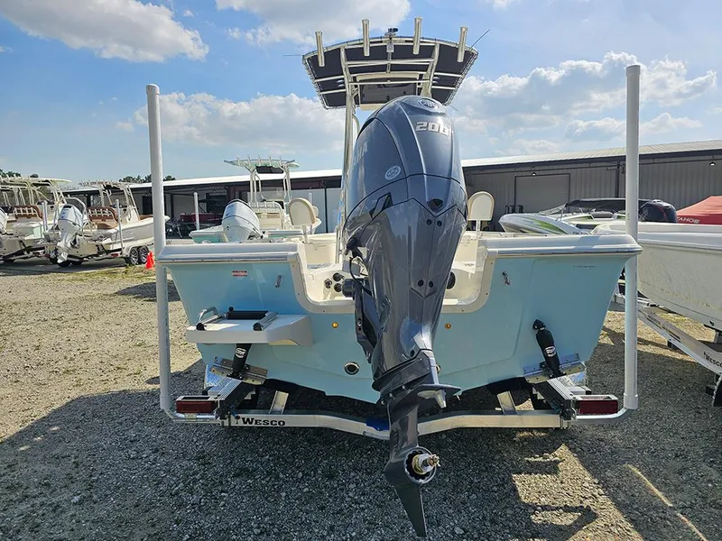 Slide: The Image of 2025 Bulls Bay 2200 XS boat with powerful outboard motor, parked outdoors. - 8