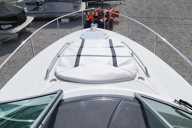 Slide: The Image of 2018 Monterey 275 Sport Yacht bow view with sunpad and railing. - 15