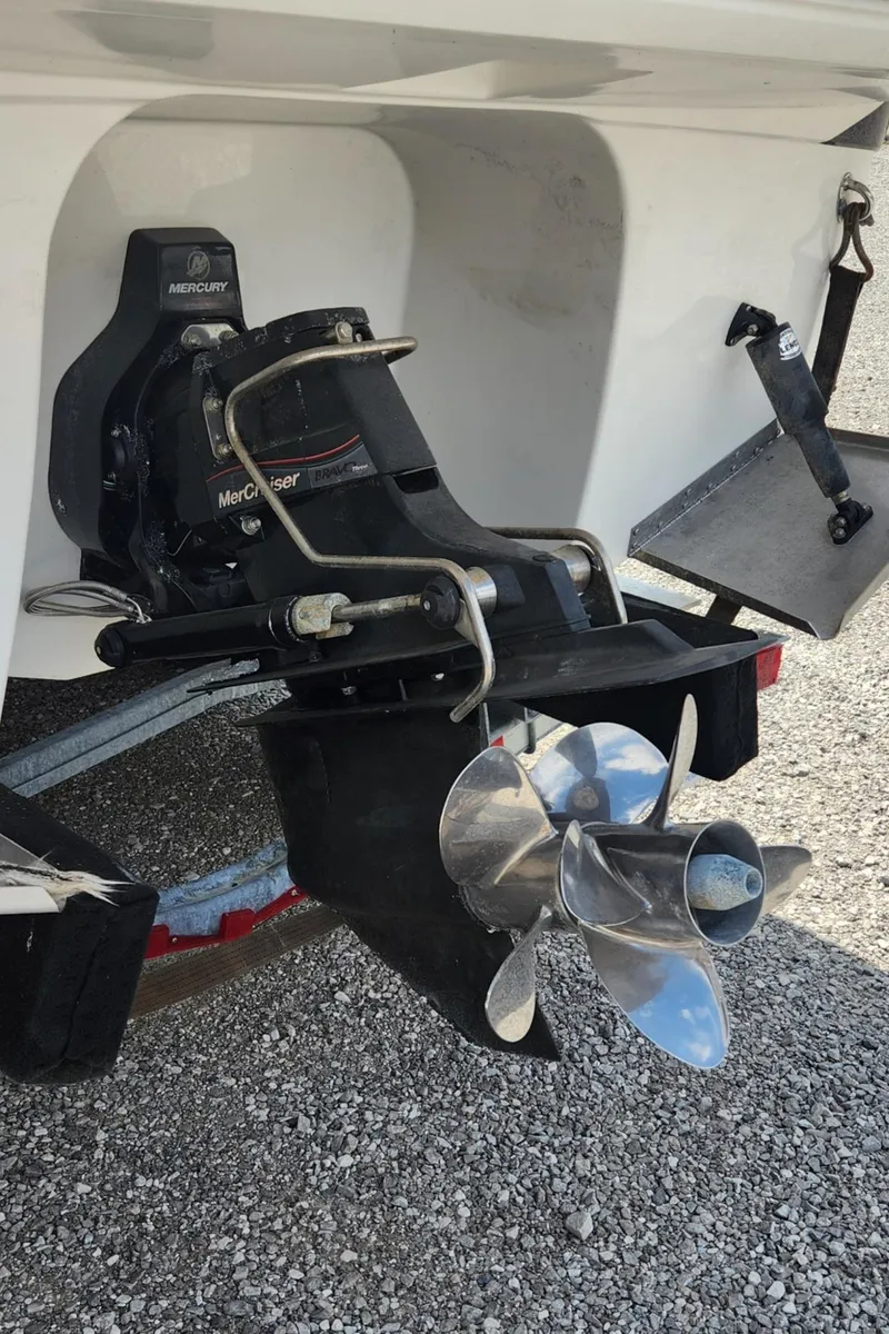 Slide: The Image of 2018 Monterey 275 Sport Yacht propeller and stern drive on gravel surface. - 17