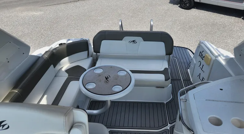 Slide: The Image of 2018 Monterey 275 Sport Yacht interior with seating and table on deck. - 4