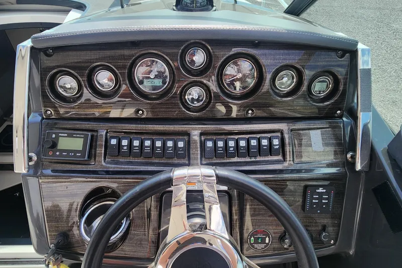 Slide: The Image of Dashboard of 2018 Monterey 275 Sport Yacht with gauges and controls. - 7