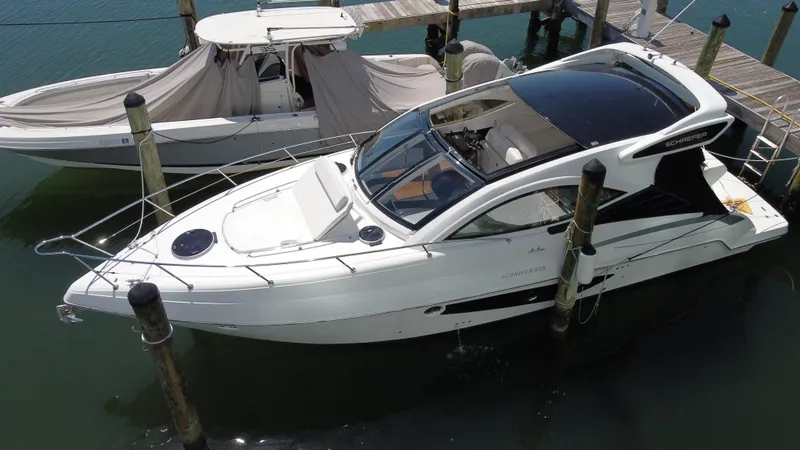 The Image of 2023 Schaefer 375 HT yacht docked at marina, aerial view. - 0