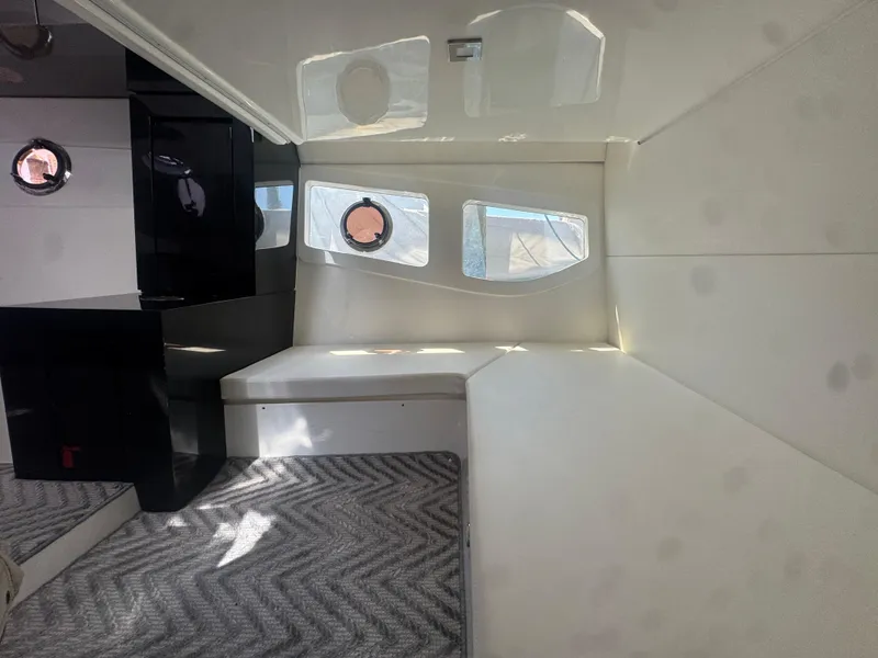 Slide: The Image of Interior of 2023 Schaefer 375 HT yacht with modern design and porthole windows. - 14