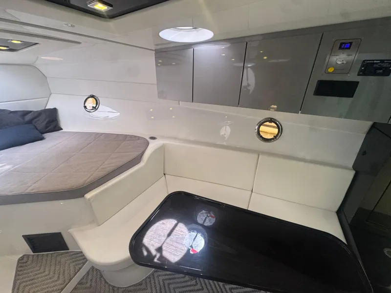 Slide: The Image of 2023 Schaefer 375 HT yacht interior with bed, seating, and table. - 19