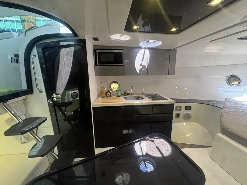 Slide: The Image of Interior of 2023 Schaefer 375 HT yacht, featuring modern kitchen and seating area. - 20