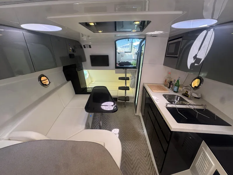 Slide: The Image of Luxurious interior of 2023 Schaefer 375 HT yacht with modern kitchen and seating area. - 22