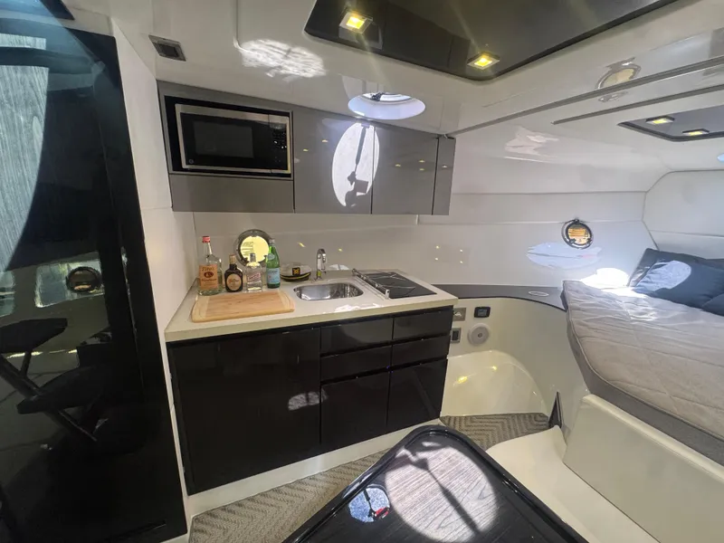 Slide: The Image of Modern interior of 2023 Schaefer 375 HT yacht with kitchenette and bed. - 23