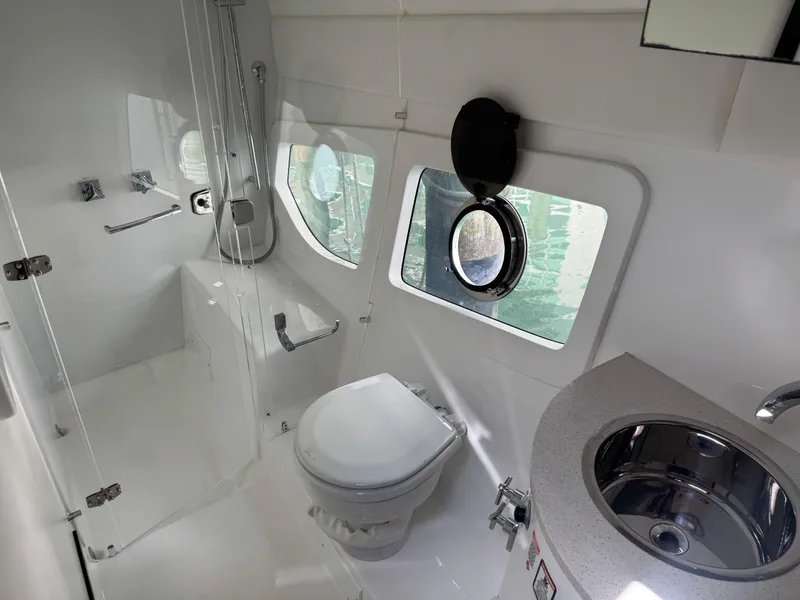 Slide: The Image of Modern bathroom in 2023 Schaefer 375 HT yacht, featuring shower, toilet, and sink. - 26