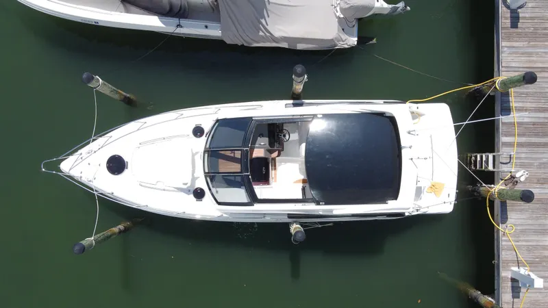 Slide: The Image of Overhead view of a 2023 Schaefer 375 HT boat docked at a marina. - 3