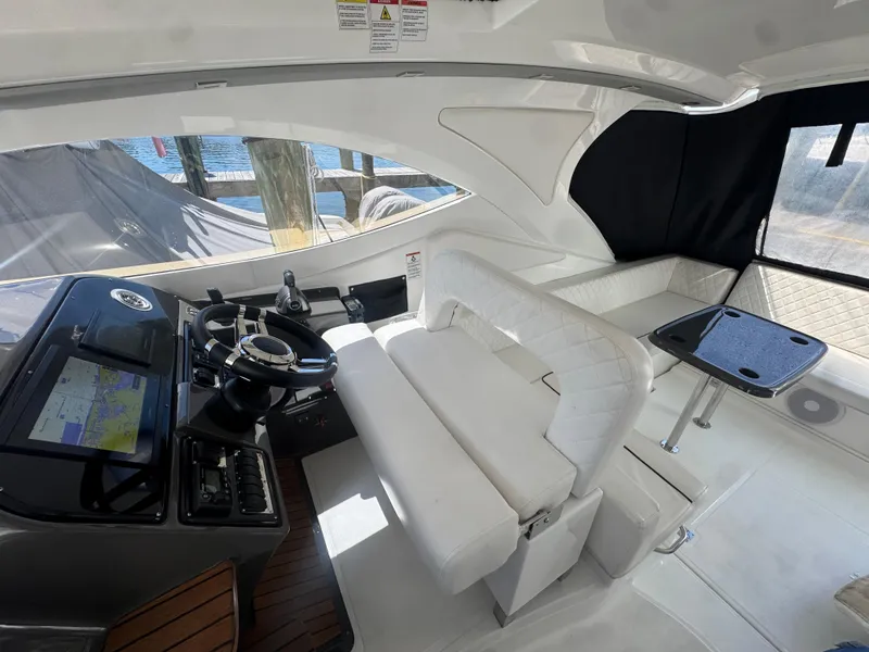 Slide: The Image of Interior of 2023 Schaefer 375 HT yacht with modern helm and seating area. - 30