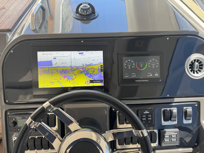 Slide: The Image of 2023 Schaefer 375 HT dashboard with navigation and control screens. - 33