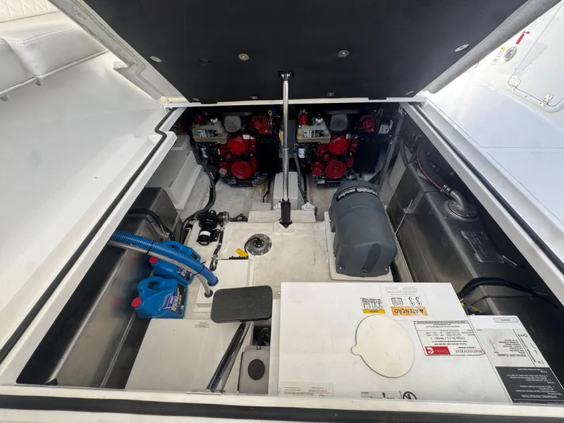 Slide: The Image of Engine compartment of 2023 Schaefer 375 HT boat, showcasing mechanical components and systems. - 35