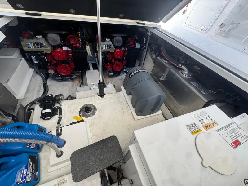 Slide: The Image of Engine compartment of 2023 Schaefer 375 HT boat, showcasing dual engines and mechanical components. - 37