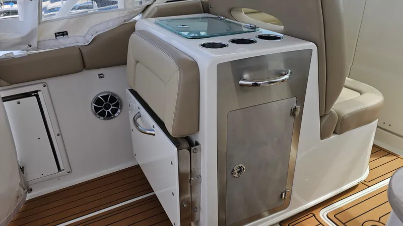 Slide: The Image of 2019 Sailfish 325 DC boat interior with seating and storage. - 23