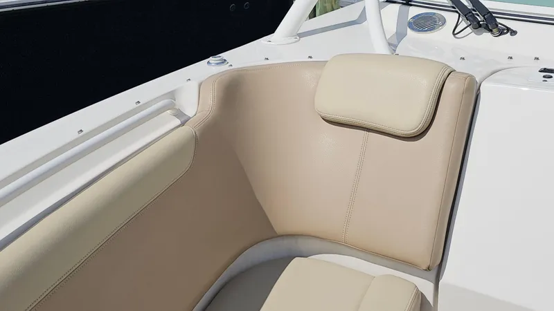 Slide: The Image of 2019 Sailfish 325 DC boat interior with beige seating and headrest. - 44