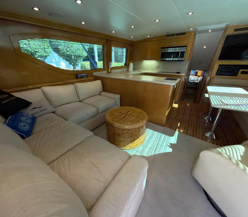 Slide: The Image of Luxurious interior of a 2001 Hatteras 55 Convertible yacht with modern furnishings. - 11