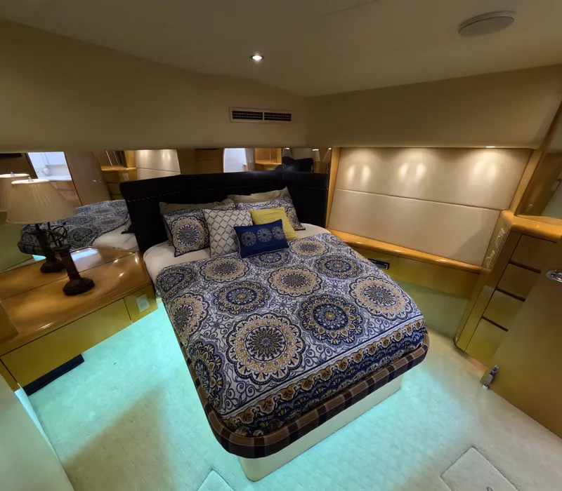 Slide: The Image of Luxurious bedroom interior of 2001 Hatteras 55 Convertible yacht with elegant bedding. - 21