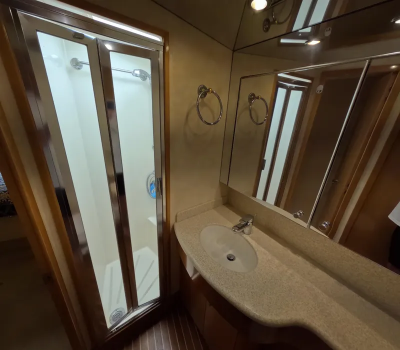 Slide: The Image of Bathroom interior of 2001 Hatteras 55 Convertible yacht with shower and vanity. - 28