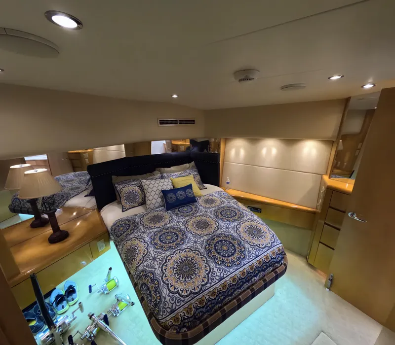 Slide: The Image of Luxurious bedroom interior of 2001 Hatteras 55 Convertible yacht with elegant bedding. - 3