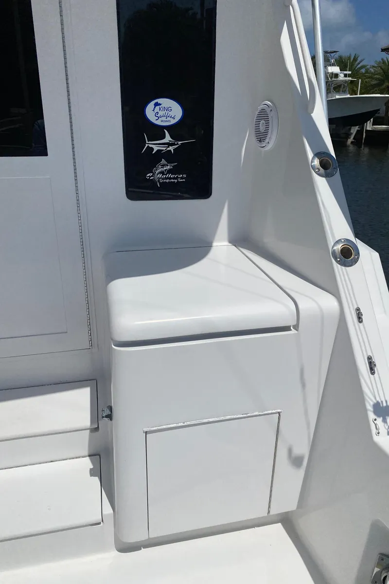 Slide: The Image of 2001 Hatteras 55 Convertible yacht, white exterior detail with seating and storage. - 53