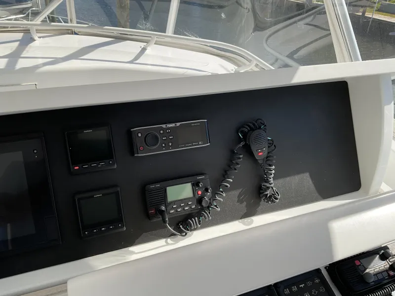 Slide: The Image of Control panel of 2001 Hatteras 55 Convertible yacht with communication devices. - 72