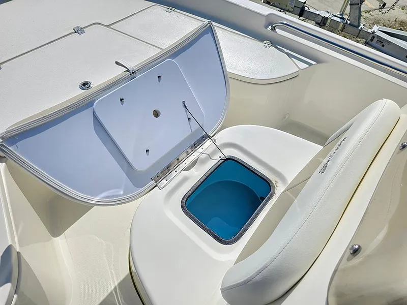 Slide: The Image of 2025 Bulls Bay 2000 boat interior with open storage compartment and seating. - 13