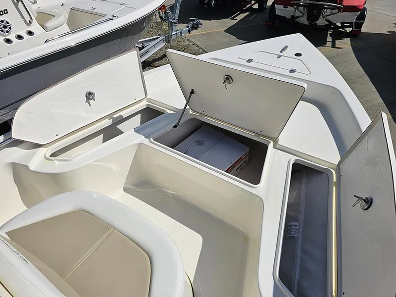 Slide: The Image of 2025 Bulls Bay 2000 boat with open storage compartments on deck. - 14