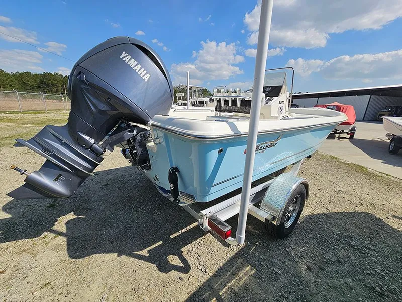 Slide: The Image of 2025 Bulls Bay 2000 boat with Yamaha engine on trailer, parked outdoors. - 2