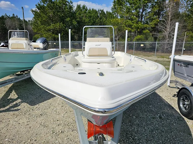 Slide: The Image of 2025 Bulls Bay 2000 boat on trailer, parked outdoors, surrounded by trees and clear sky. - 3