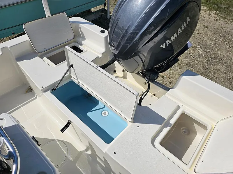 Slide: The Image of 2025 Bulls Bay 2000 boat with Yamaha engine, featuring open storage compartments. - 8