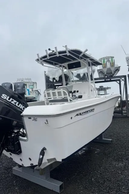Slide: The Image of 2022 Aquasport 2100 Center Console boat with Suzuki engine on display. - 15