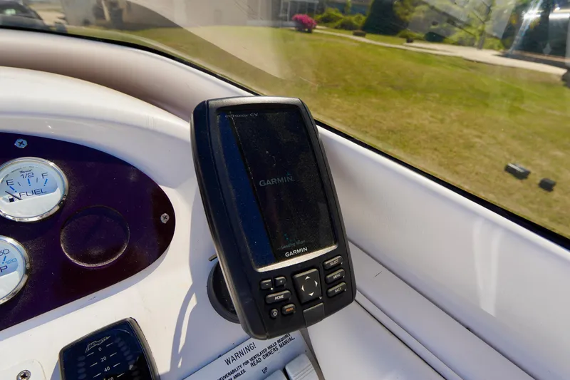 Slide: The Image of Garmin GPS device on 1999 Donzi 26 ZX boat dashboard. - 13