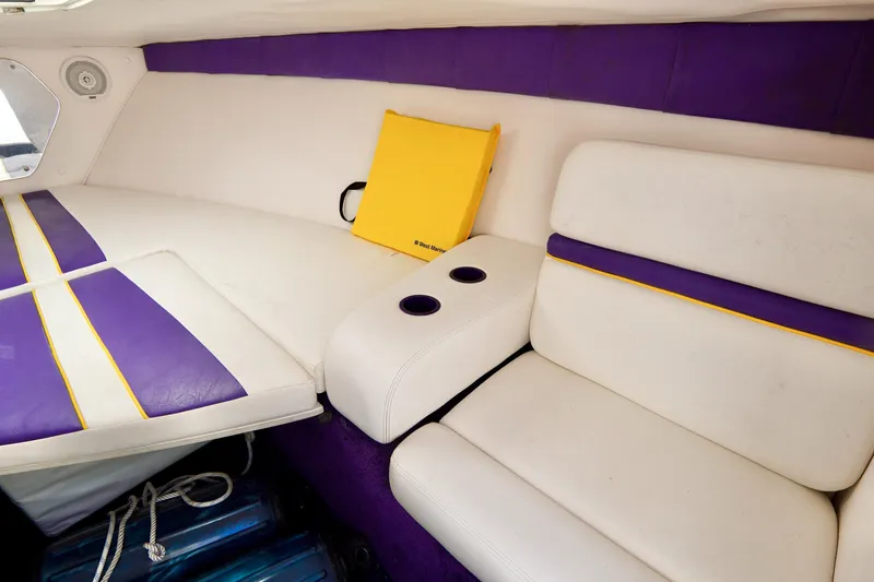 Slide: The Image of Interior of 1999 Donzi 26 ZX boat with white and purple seating. - 17