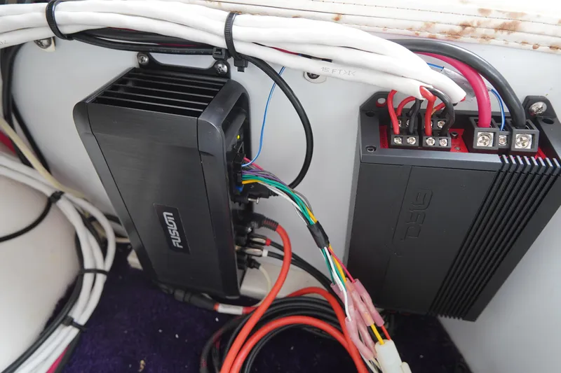 Slide: The Image of 1999 Donzi 26 ZX boat audio system wiring and amplifiers. - 19