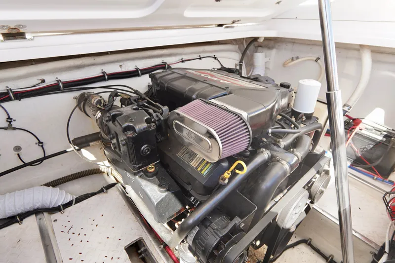 Slide: The Image of 1999 Donzi 26 ZX engine compartment showcasing a powerful marine engine. - 22