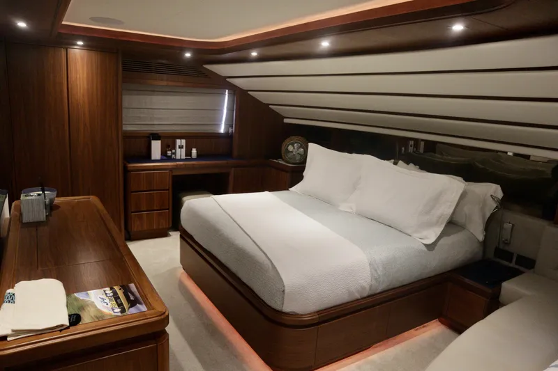 Slide: The Image of Luxurious bedroom interior on 2016 Custom Line 97 yacht with elegant wood finishes. - 11