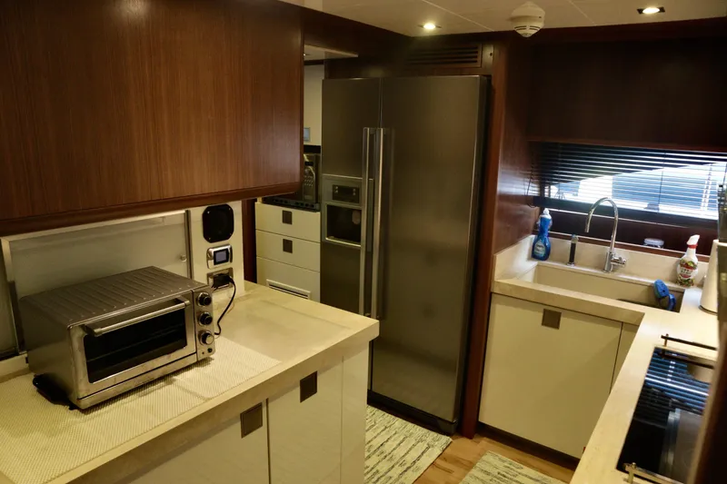 Slide: The Image of Luxurious kitchen interior of 2016 Custom Line 97 yacht with modern appliances. - 13