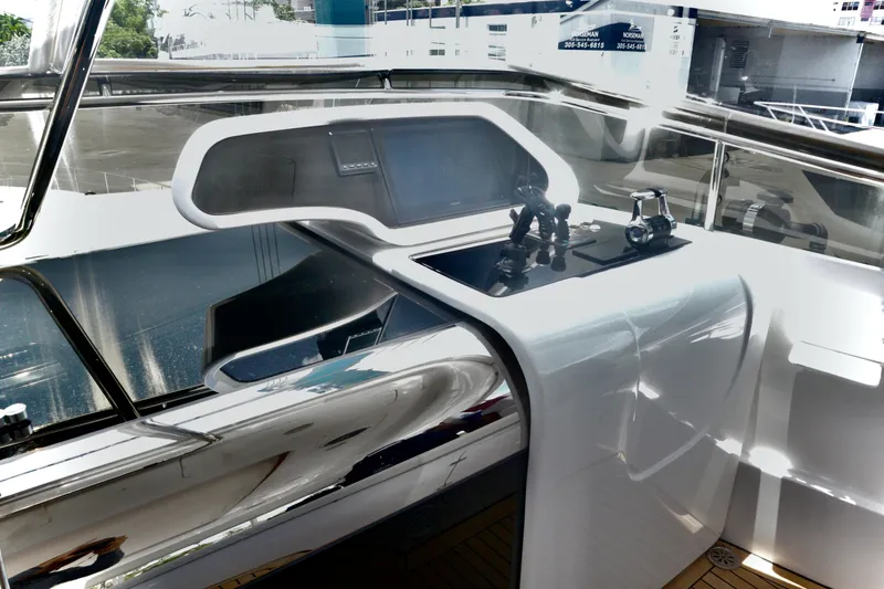 Slide: The Image of Helm station of 2016 Custom Line 97 yacht with sleek, modern design and controls. - 18