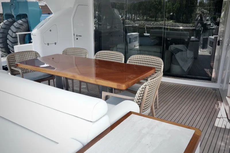Slide: The Image of Luxurious outdoor dining area on a 2016 Custom Line 97 yacht with elegant seating. - 21