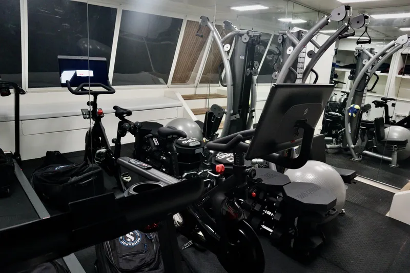 Slide: The Image of Fitness equipment in a modern gym aboard a 2016 Custom Line 97 yacht. - 27