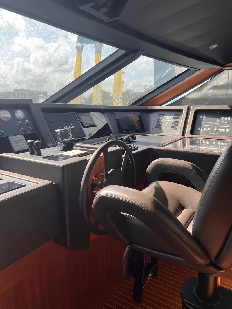 Slide: The Image of Cockpit of 2016 Custom Line 97 yacht with modern controls and leather seating. - 36