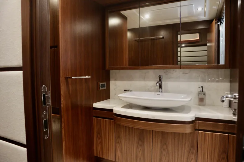 Slide: The Image of Luxurious bathroom interior on 2016 Custom Line 97 yacht with elegant wood finish. - 12