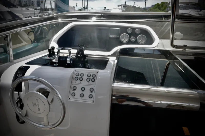 Slide: The Image of Helm of 2016 Custom Line 97 yacht with modern controls and steering wheel. - 17