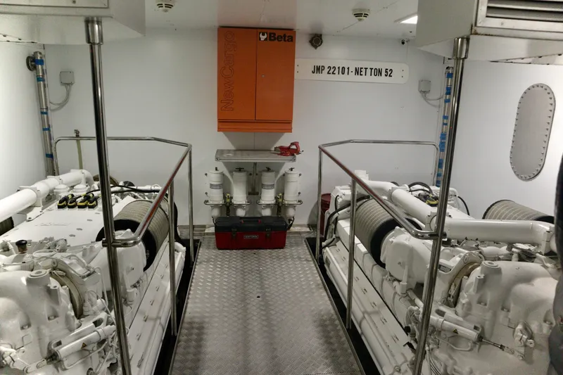 Slide: The Image of Engine room of 2016 Custom Line 97 yacht, featuring dual engines and control systems. - 31