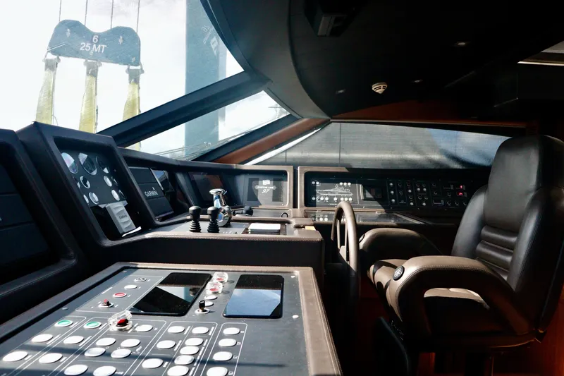 Slide: The Image of Pilothouse of 2016 Custom Line 97 yacht with advanced navigation controls and leather seating. - 34