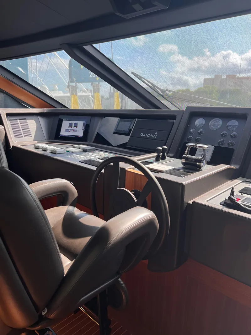 Slide: The Image of Helm of 2016 Custom Line 97 yacht with modern navigation equipment. - 35