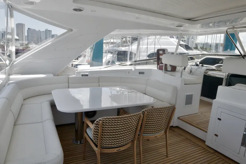 Slide: The Image of Luxurious 2016 Custom Line 97 yacht interior with elegant seating and dining area. - 19